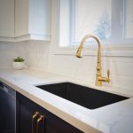 Gold colour kitchen faucet; undermount kitchen sink.