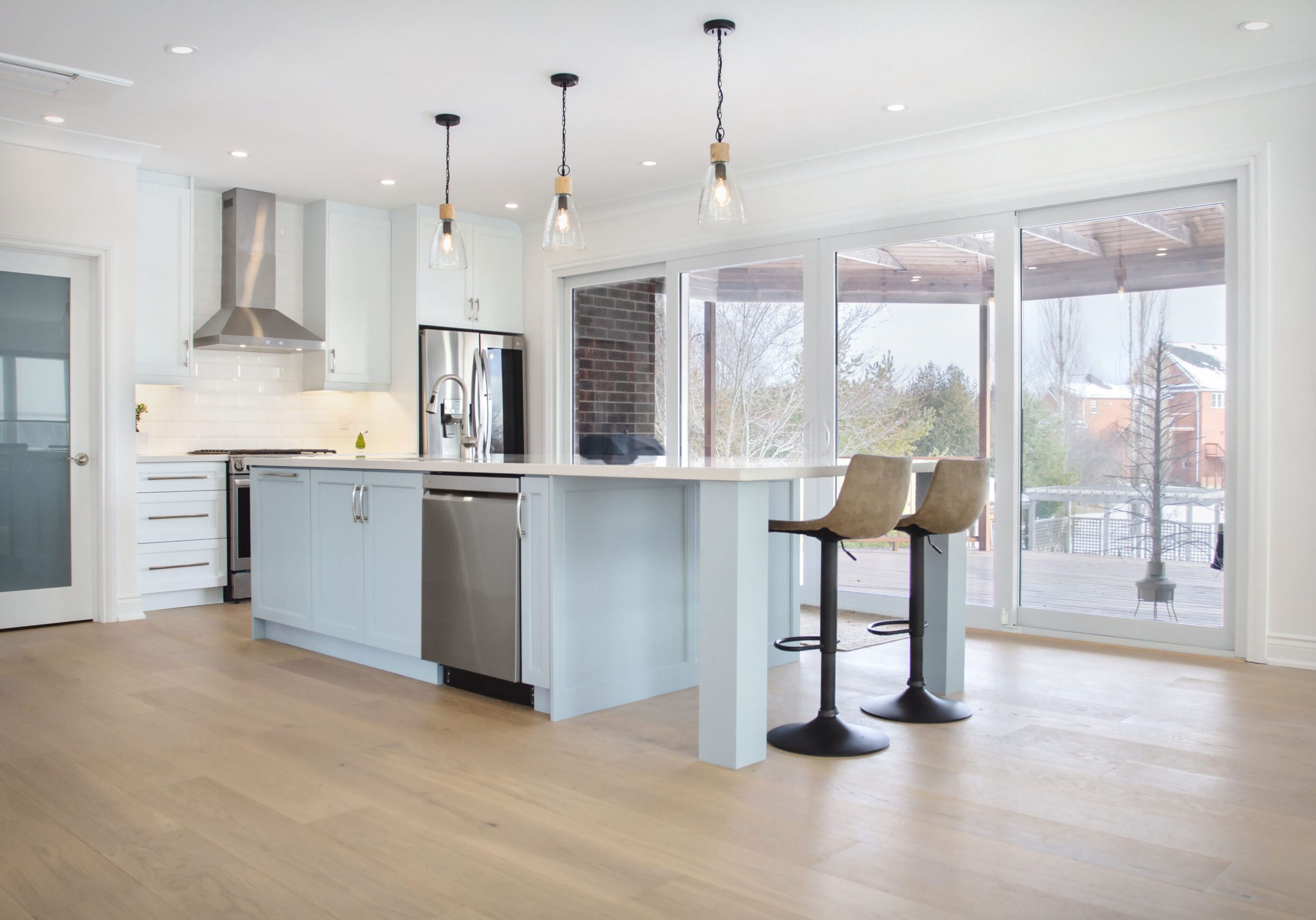 Kitchen renovation in Halton Hills Ontario, looking out a full wall patio door.